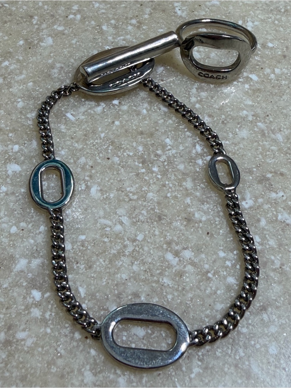 Coach Silver-Tone Oval Link Bracelet with Teal Accent